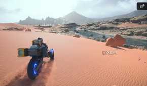 Sam driving a trike on desert sands in Death Stranding 2.