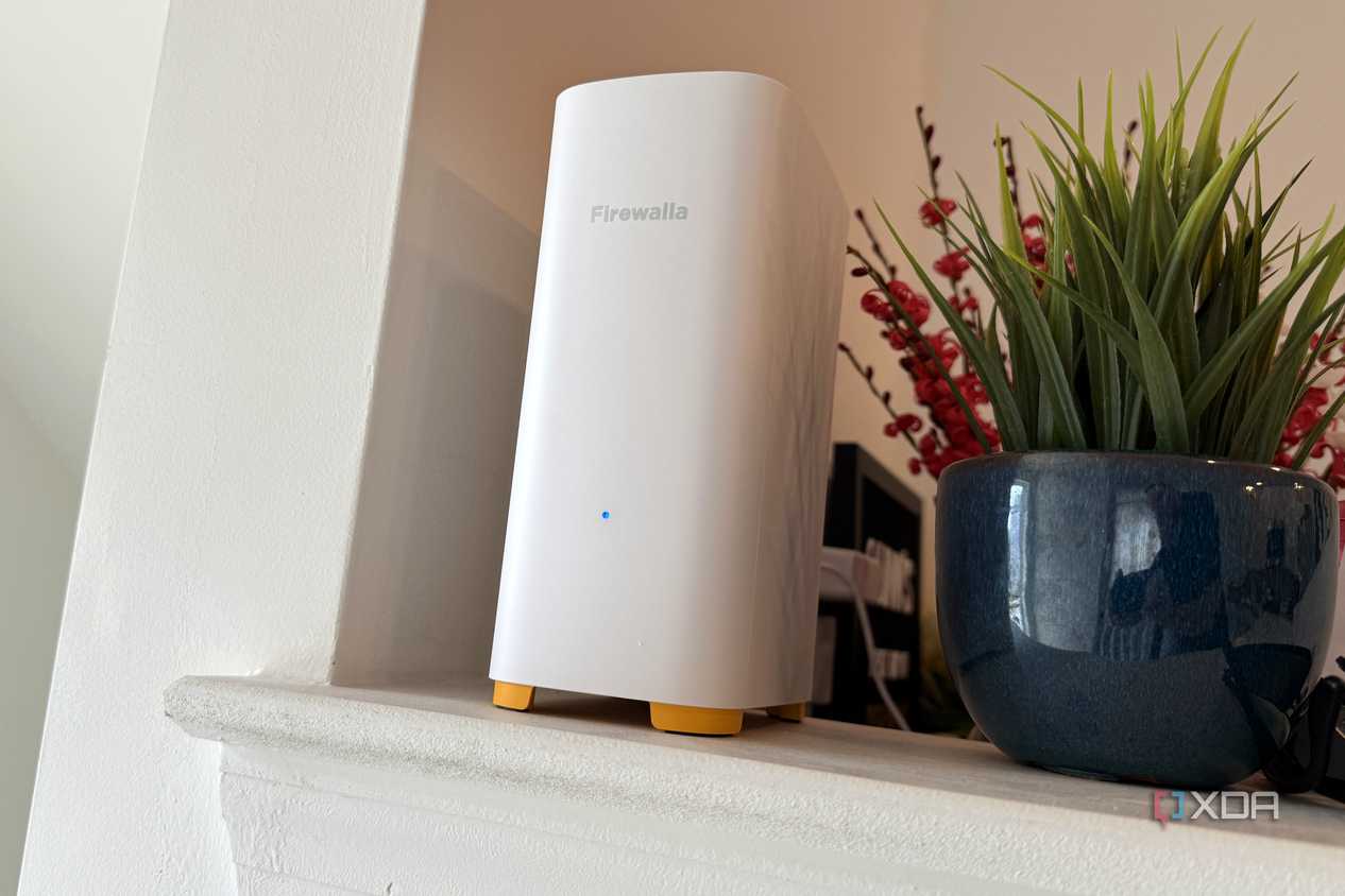 firewalla ap7 on counter next to a plant pot