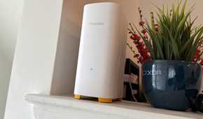 firewalla ap7 on counter next to a plant pot