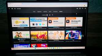 photo of a laptop with YouTube on Jellyfin using TubeArchivist plugin