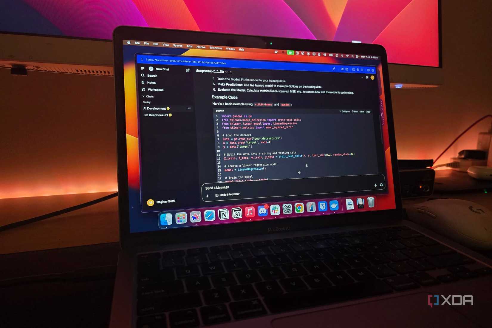 A MacBook air connected to a monitor running DeepSeek-R1 locally