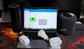 A photo of smart plugs, smart bulbs, smart speakers, and a laptop running Home Assistant