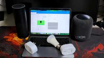 A photo of smart plugs, smart bulbs, smart speakers, and a laptop running Home Assistant