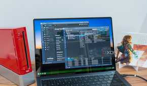 A Windows 11 laptop displaying the TrueNAS and Proxmox dashboards
