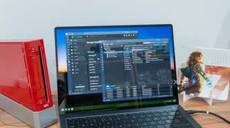 A Windows 11 laptop displaying the TrueNAS and Proxmox dashboards