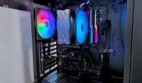 A close up of the interior of a black gaming PC with rainbow RGB fans