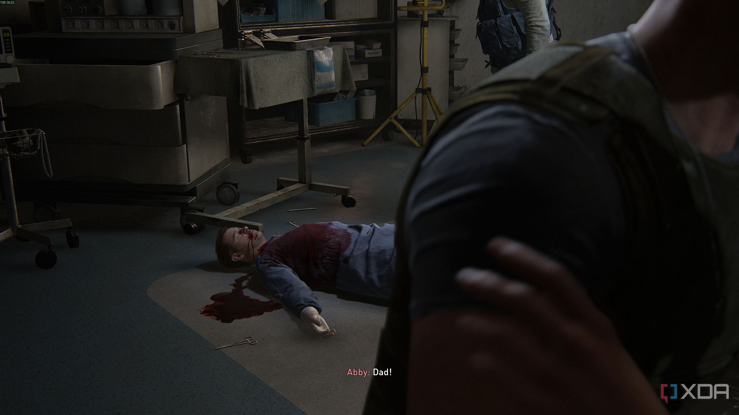 A dead surgeon in scrubs in The Last of Us Part II.