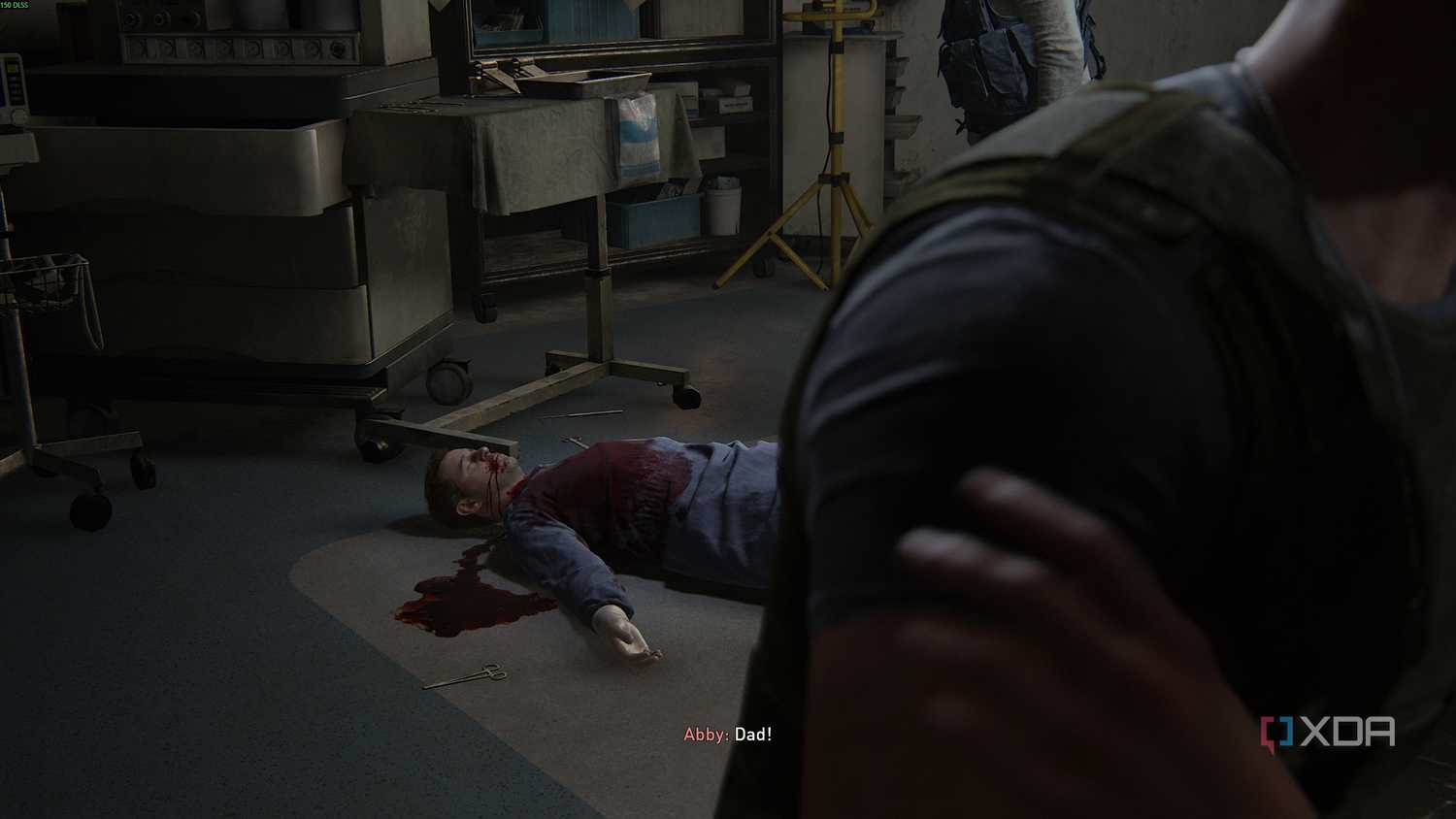 A dead surgeon in scrubs in The Last of Us Part II.