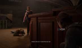 Abby holding a gun over a prone Tommy in The Last of Us Part II.