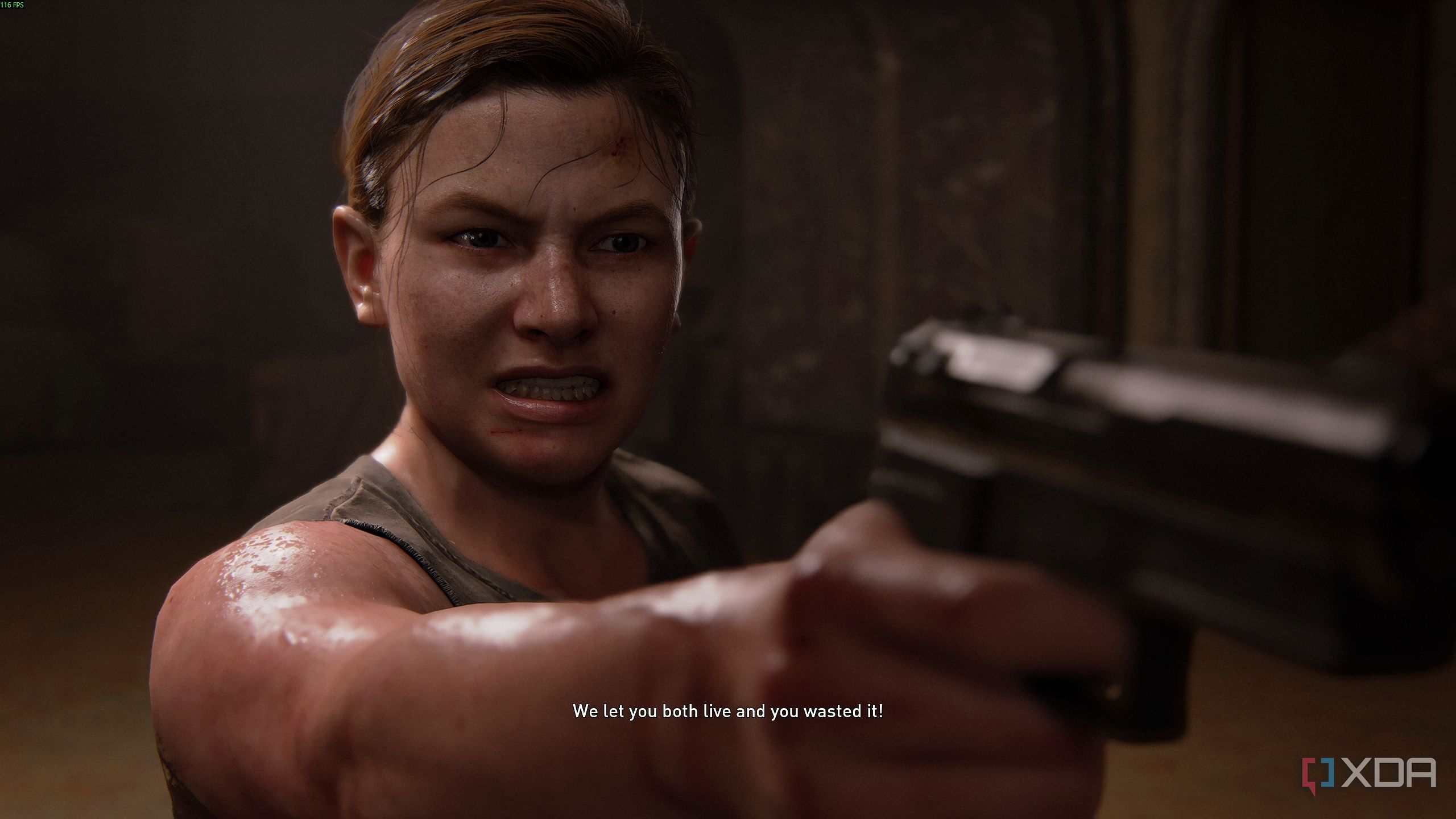 Abby pointing a gun angrily in The Last of Us Part II.