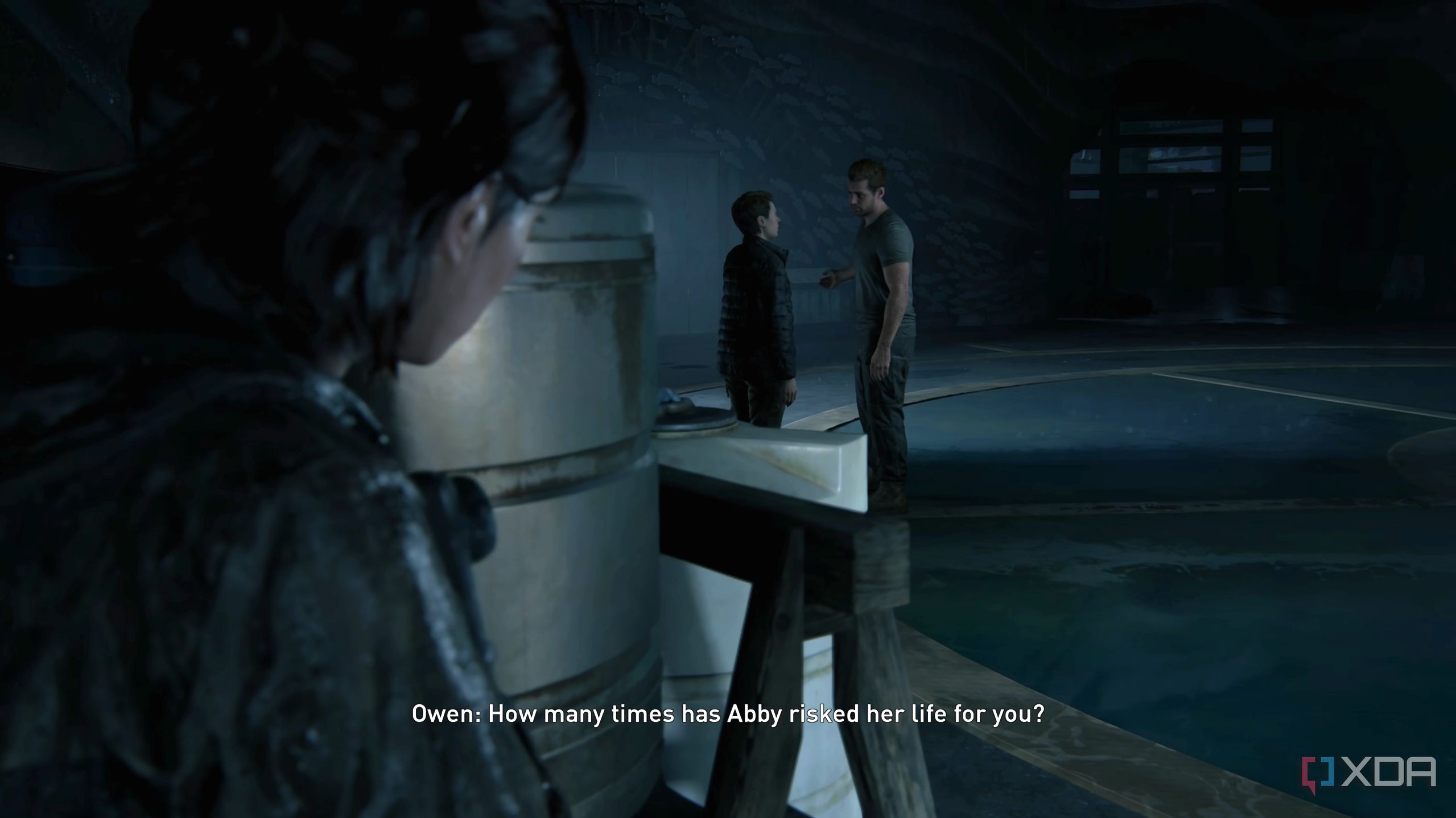 Ellie peeking at Owen and Mel in The Last of Us Part II Remastered.