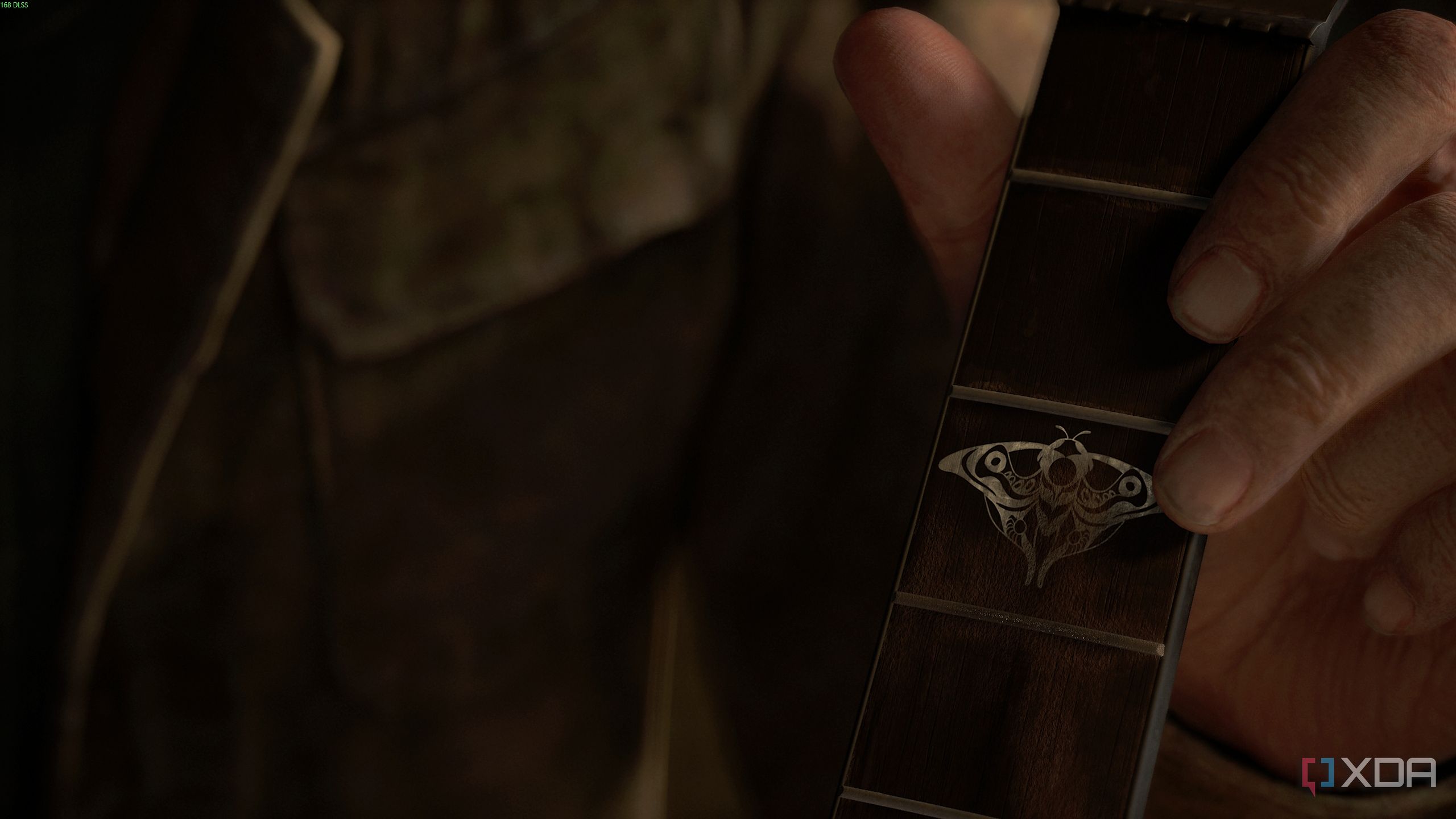 Joel holding a guitar in The Last of Us Part II.