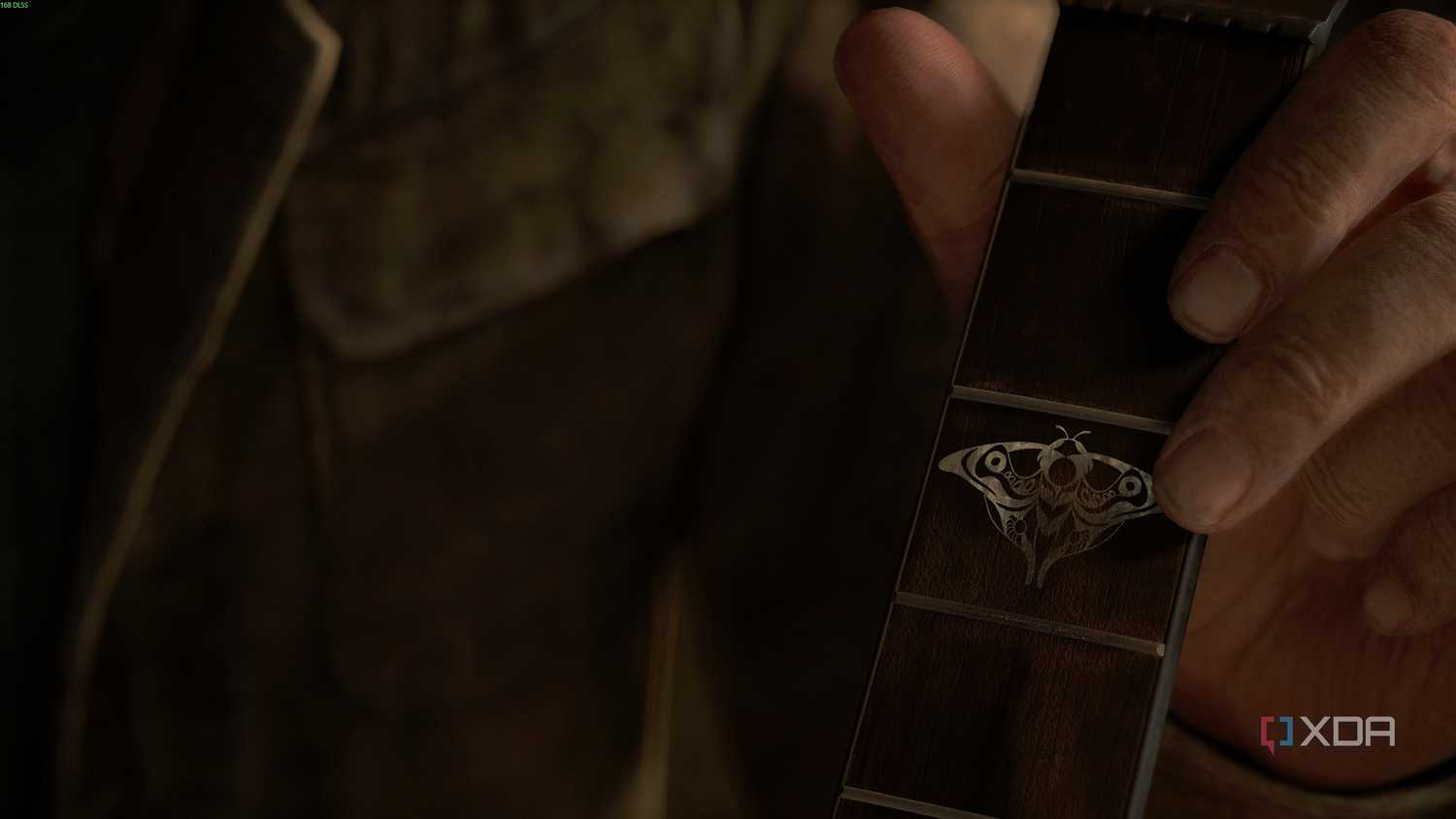 Joel holding a guitar in The Last of Us Part II.