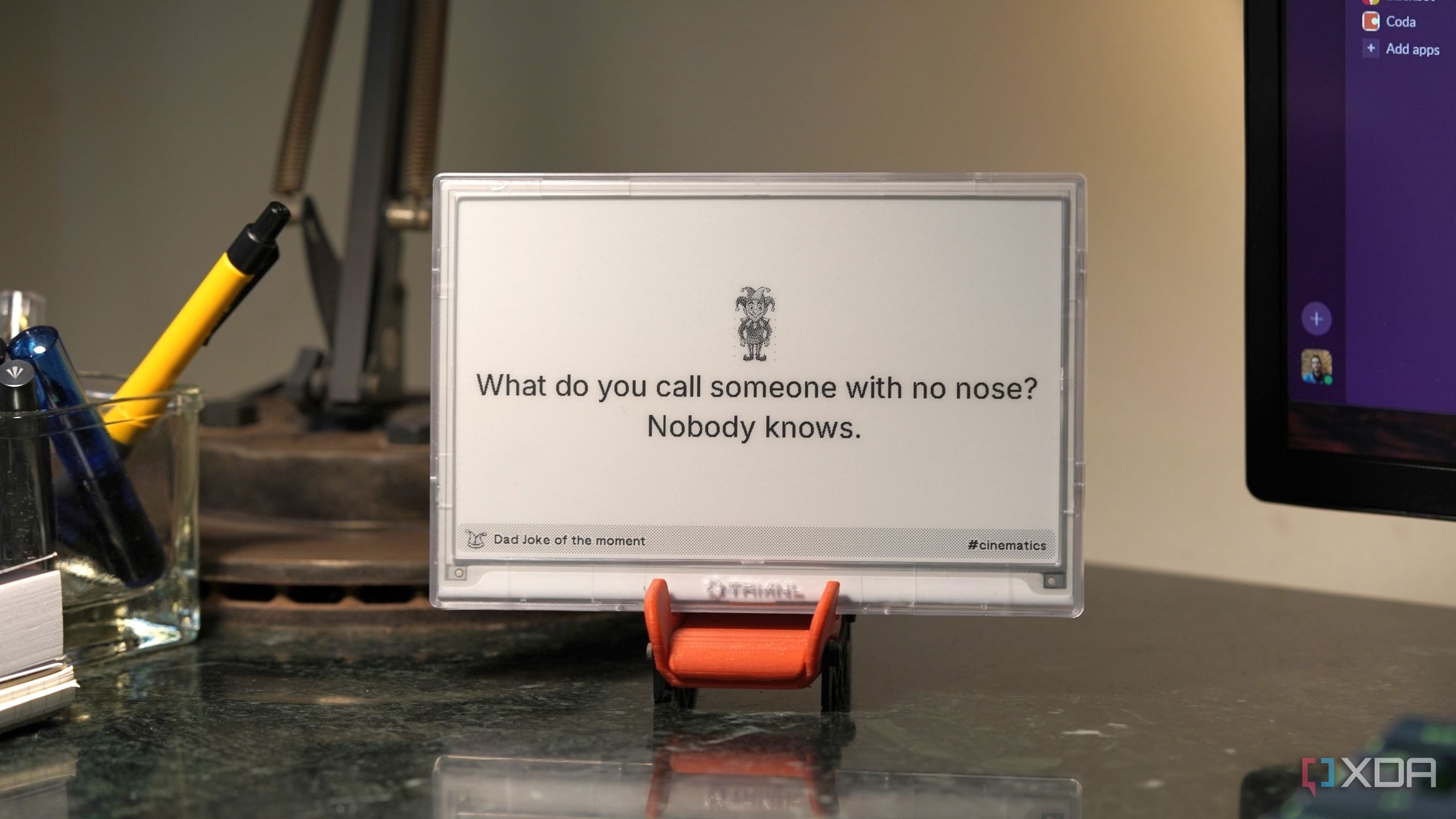 An e-ink display showing a joke