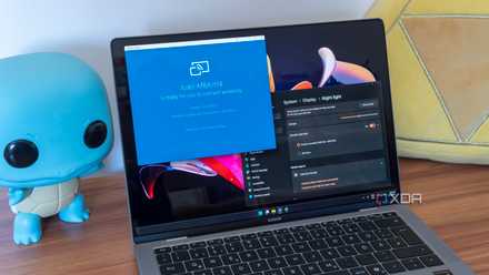 A Windows 11 laptop running the wireless display app and showing night light settings