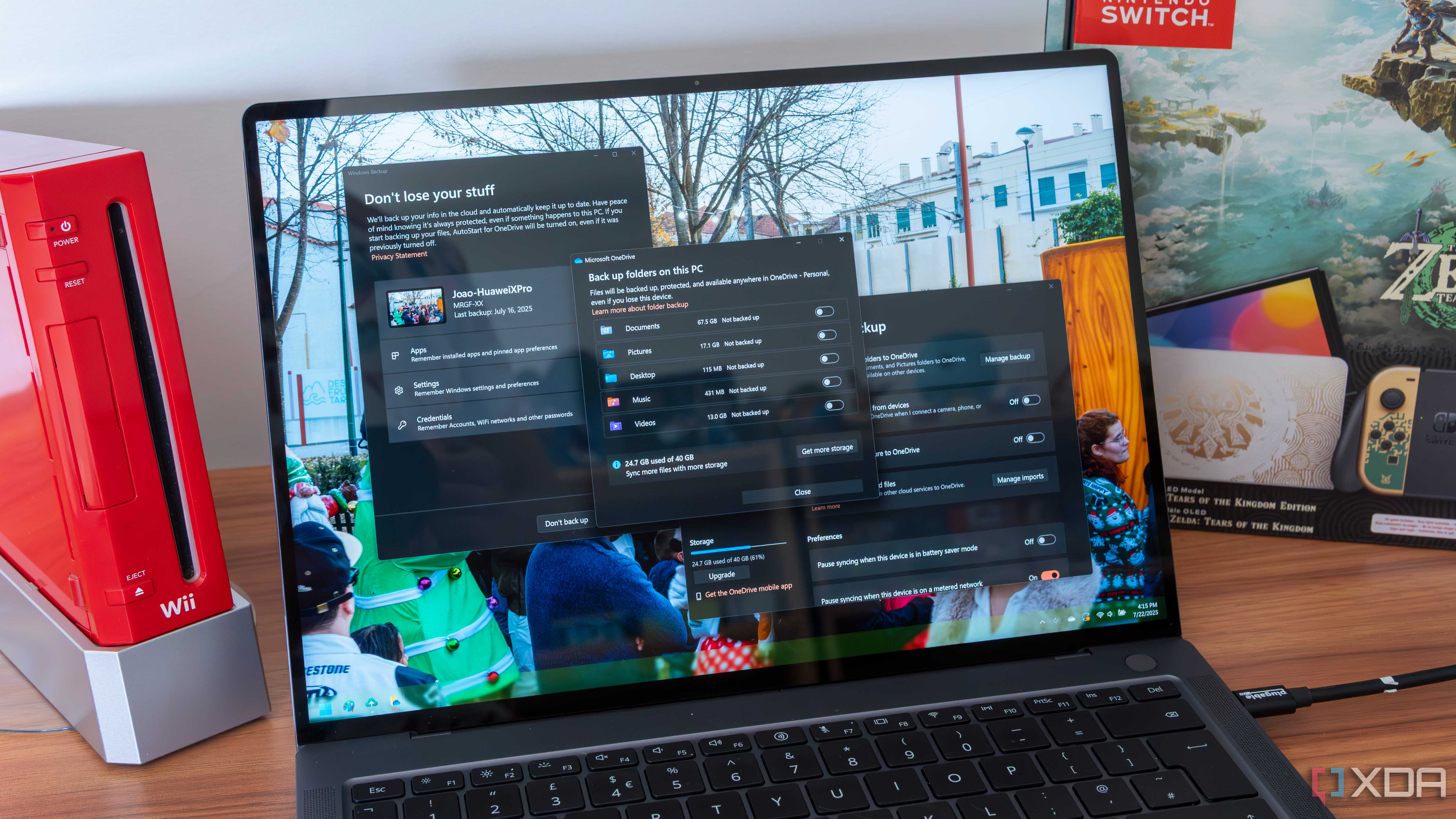 A Windows 11 laptop showing Windows backup and OneDrive backup options