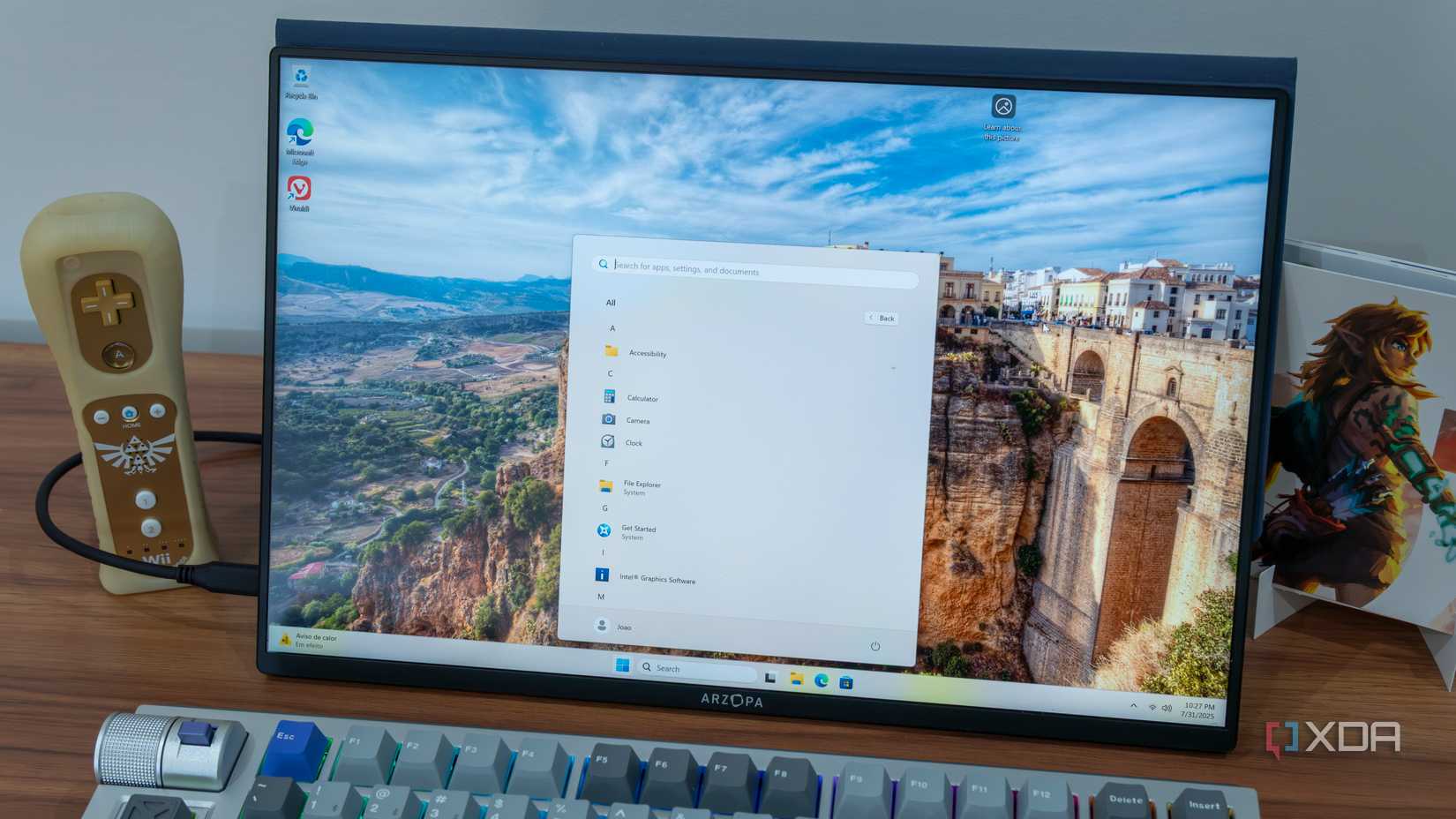 A computer screen displaying a Windows 11 desktop and Start menu with many of the built-in apps removed