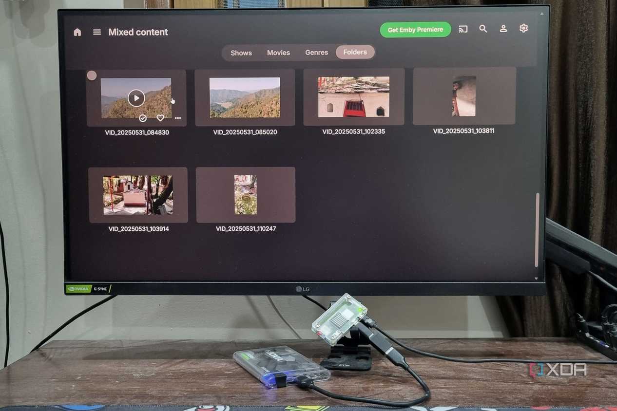 photo of windows pc next to raspberry pi running emby