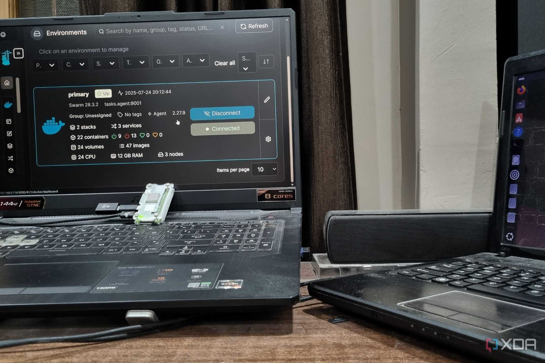 photo of a windows pc next to raspberry pi running in cluster docker swarm