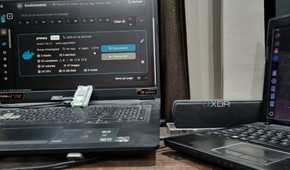photo of a windows pc next to raspberry pi running in cluster docker swarm