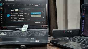 photo of a windows pc next to raspberry pi running in cluster docker swarm