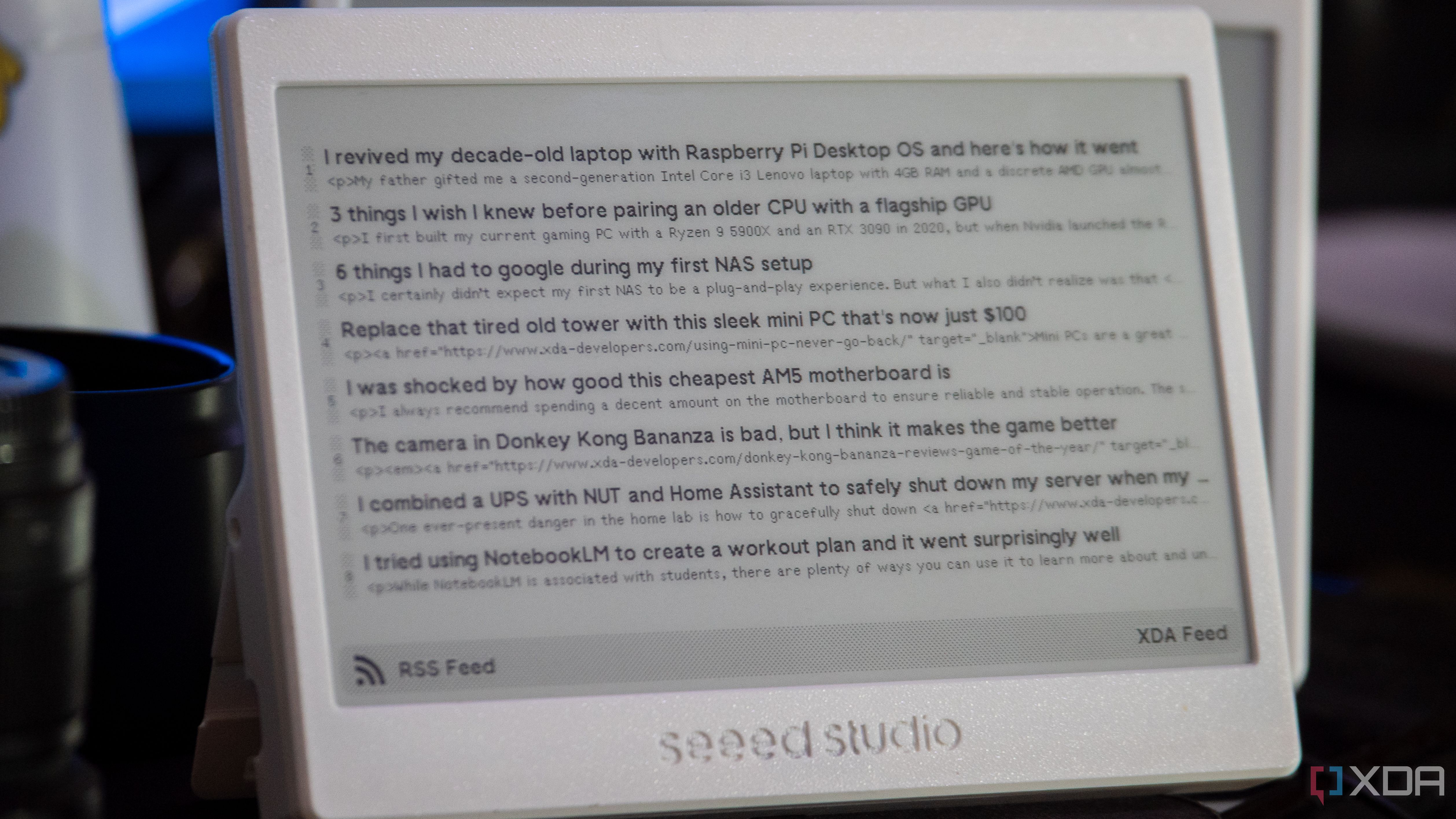 XIAO ePaper Panel running TRMNL, showing the XDA RSS feed