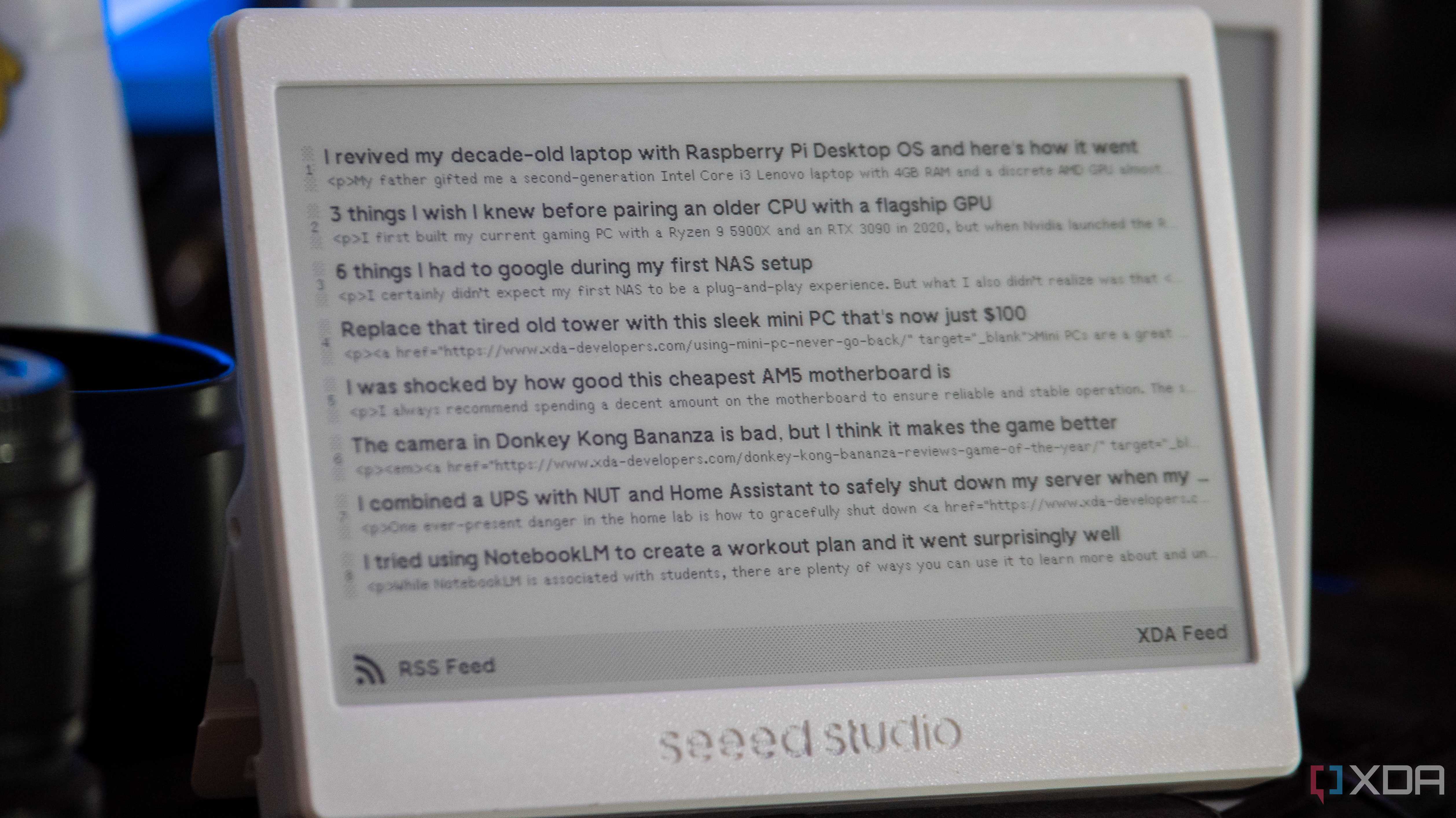 XIAO ePaper Panel running TRMNL, showing the XDA RSS feed
