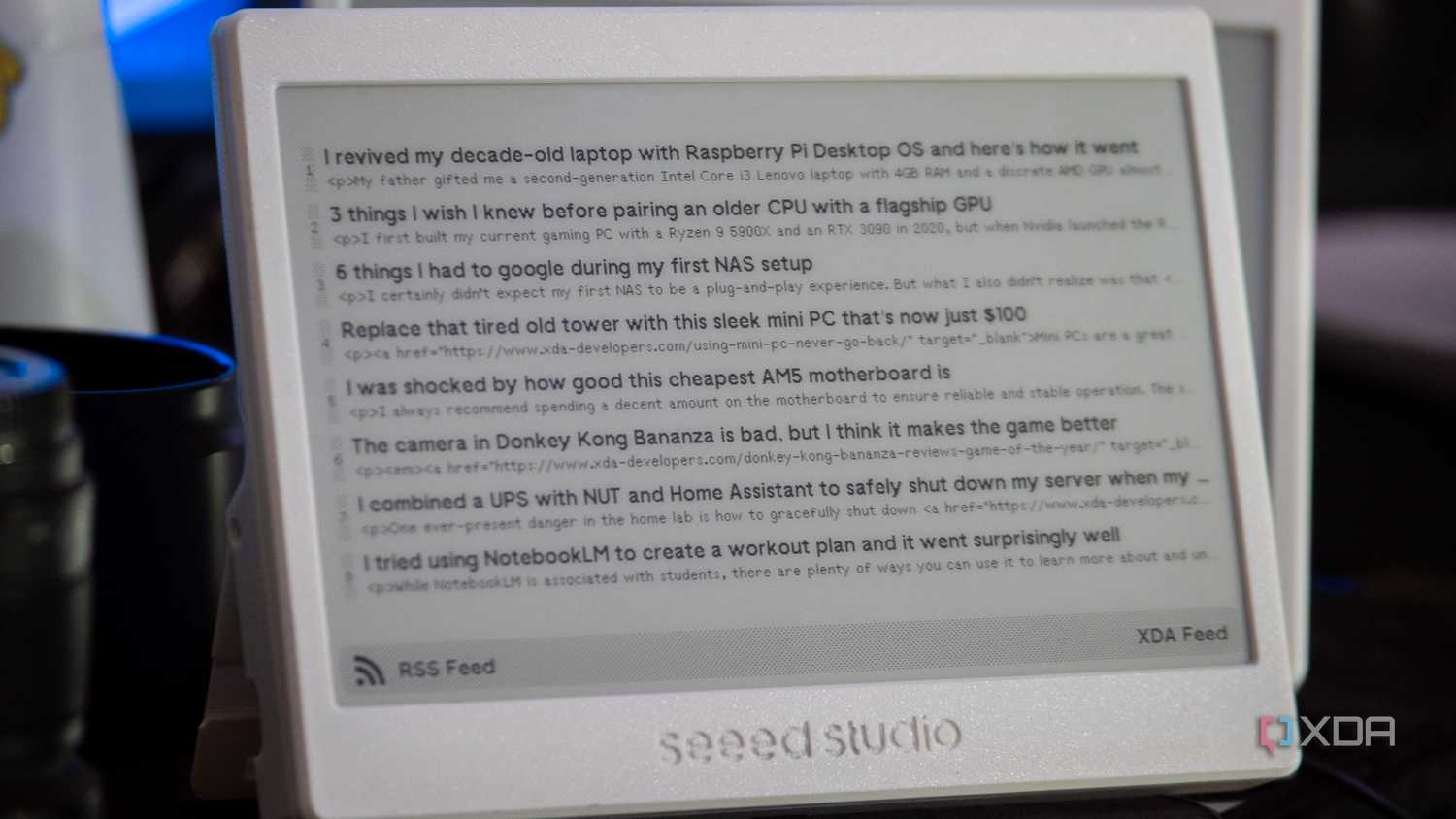 XIAO ePaper Panel running TRMNL, showing the XDA RSS feed