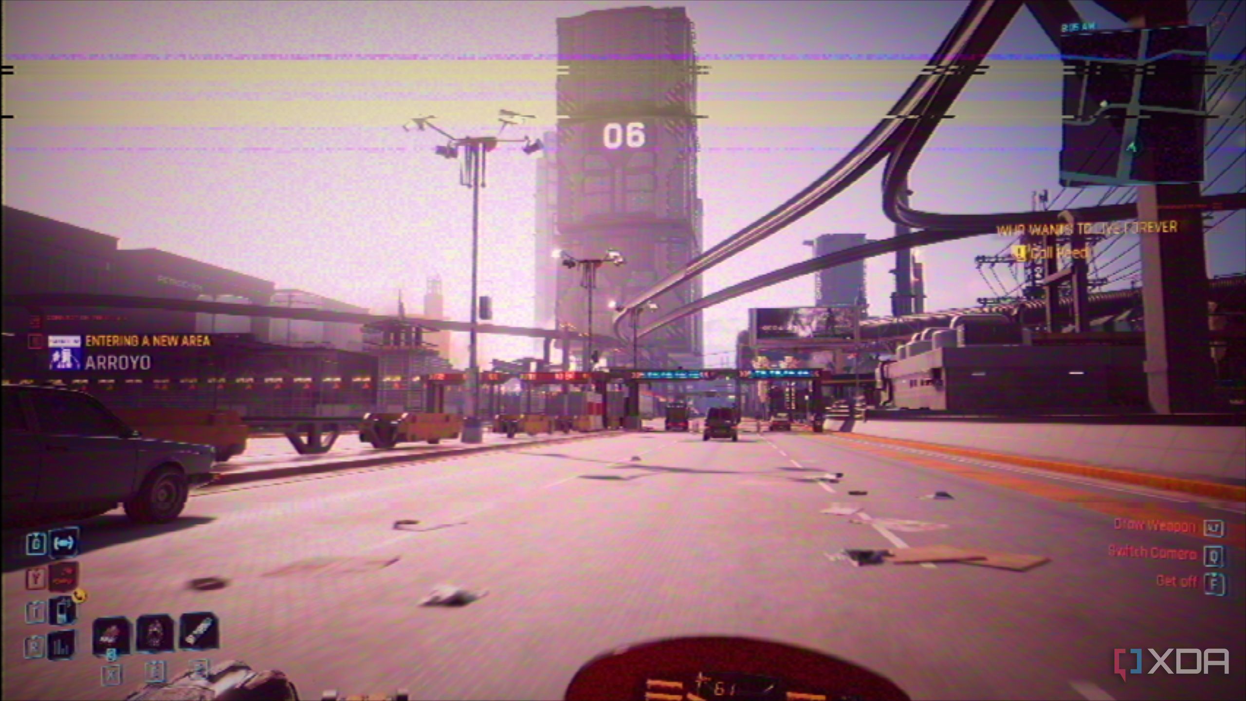 Driving a motorcycle in Cyberpunk 2077 with a VHS filter on.