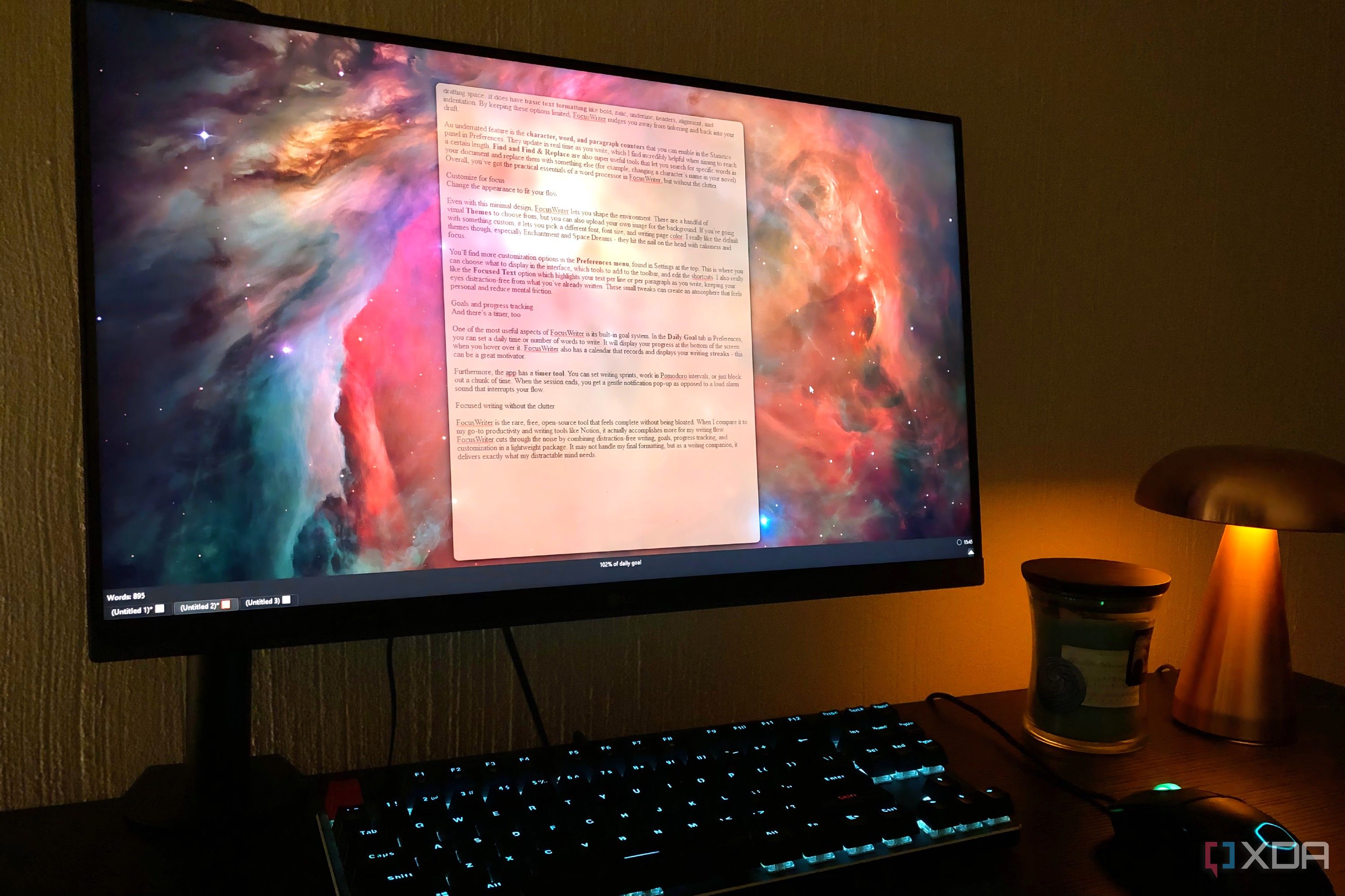 FocusWriter displayed on desktop pc, lamp and candle in view
