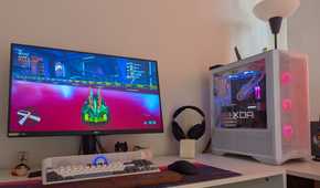 A gaming PC showing RGB lighting synced with the scene on the monitor