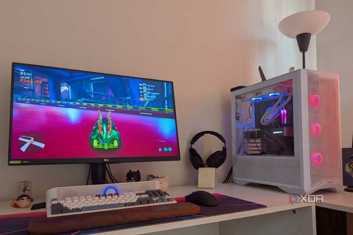 A gaming PC showing RGB lighting synced with the scene on the monitor