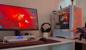 A gaming PC showing RGB lighting synced with the scene on the monitor