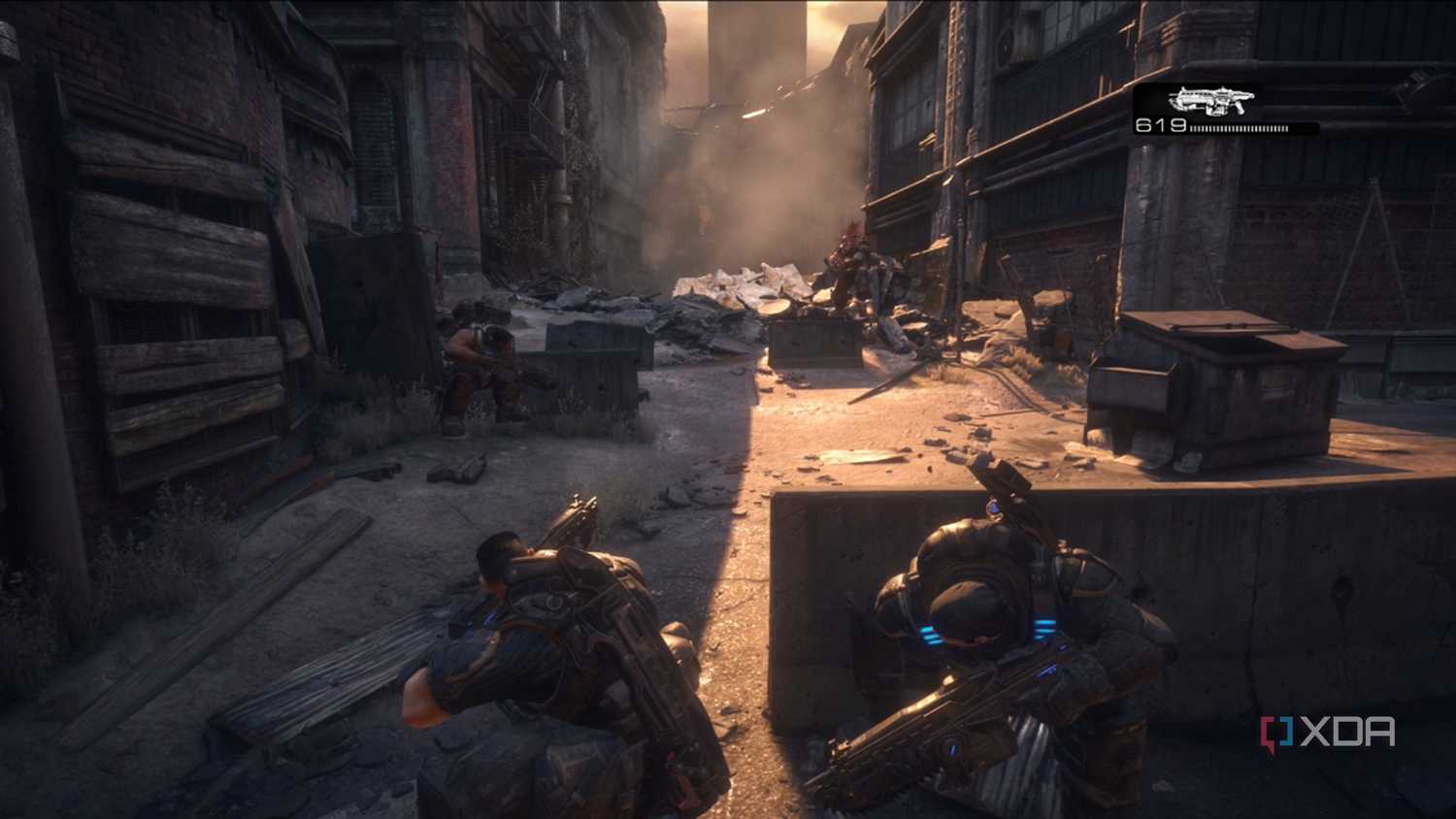 A screenshot of Dom and Marcus facing an emergence hole in Gears of War: Reloaded