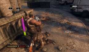 A screenshot of stomping an enemy during multiplayer in Gears of War: Reloaded