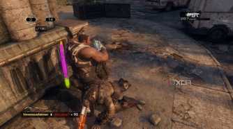 A screenshot of stomping an enemy during multiplayer in Gears of War: Reloaded