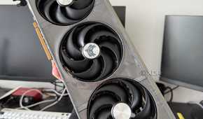 Someone holding a 9070 XT graphics card