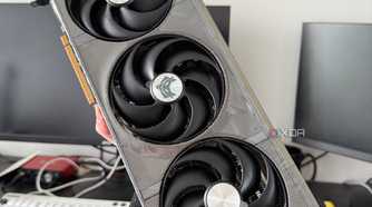 Someone holding a 9070 XT graphics card