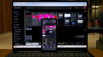 photo of Immich self-hosted platform with mobile apps on mobile and laptop