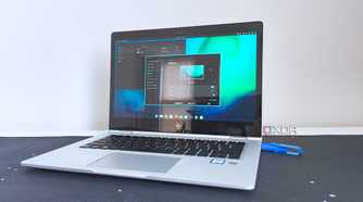 photo of a 2017 HP Elitebook x360 1030 G2 running Fedora Linux with the Cosmic desktop environment