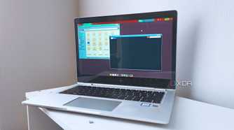 A 2017 HP EliteBook x360 1030 G2 running Fedora 42 with the XFCE desktop environment and a retro panel theme