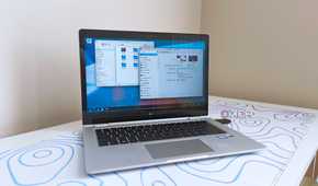 photo of a 2017 HP Elitebook x360 1030 G2 running Fedora Linux with the KDE desktop environment