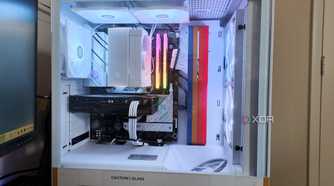 An NZXT H5 Flow Starfield gaming PC case with complete backlit build inside seen from the side