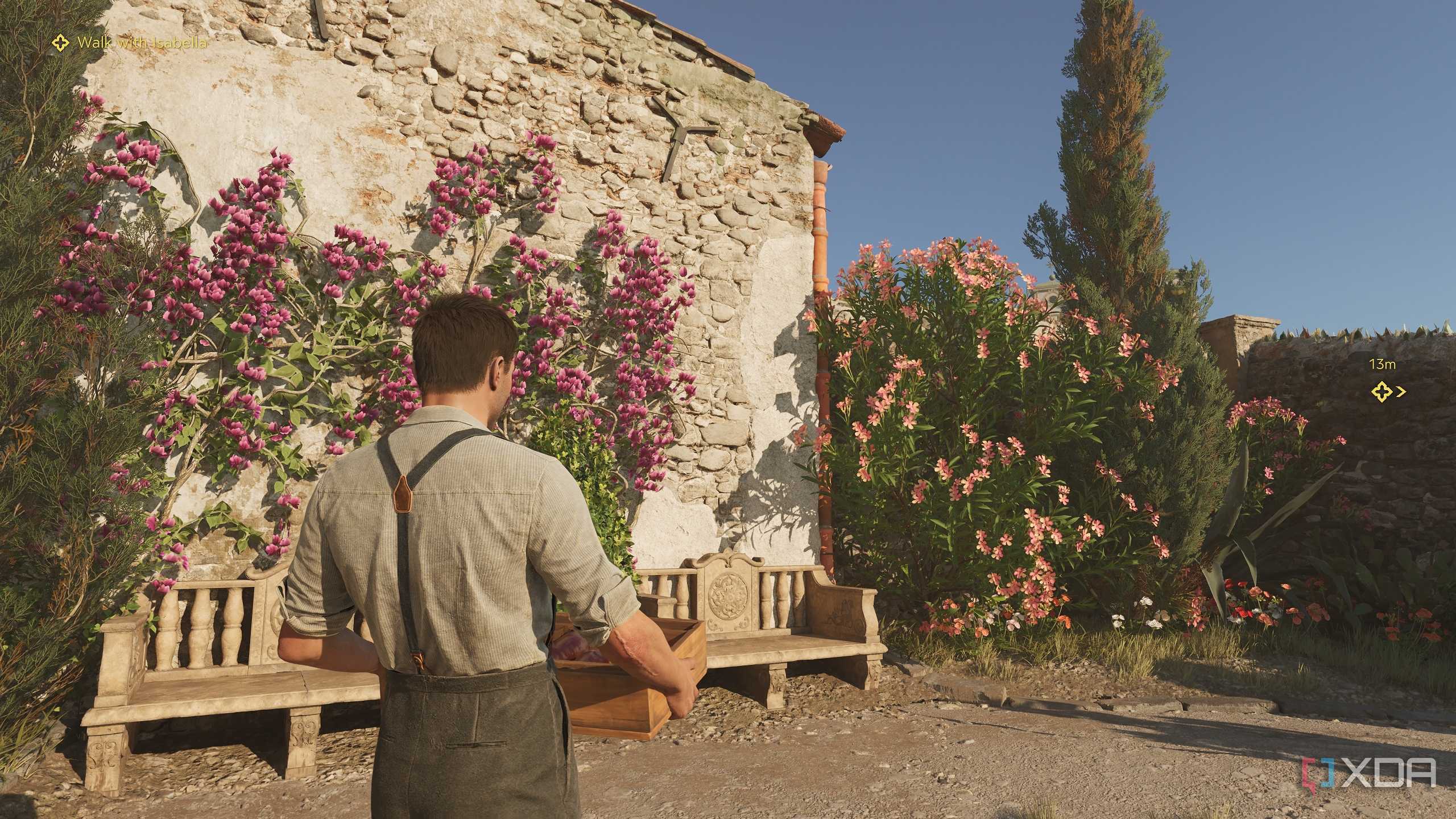 Enzo carrying a crate of wine in Mafia: The Old Country.
