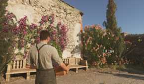 Enzo carrying a crate of wine in Mafia: The Old Country.