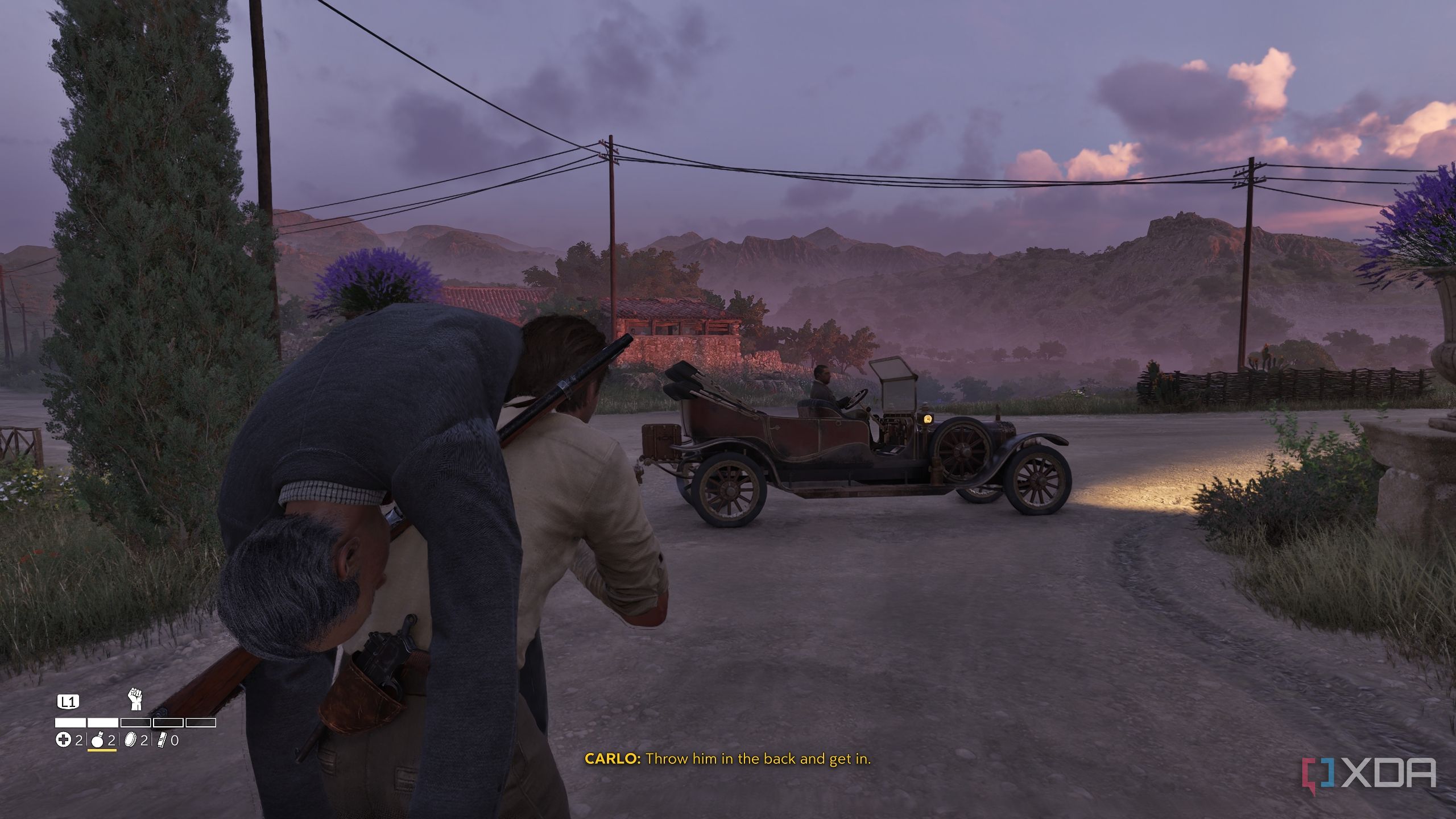 Carrying a man towards a car in Mafia: The Old Country.