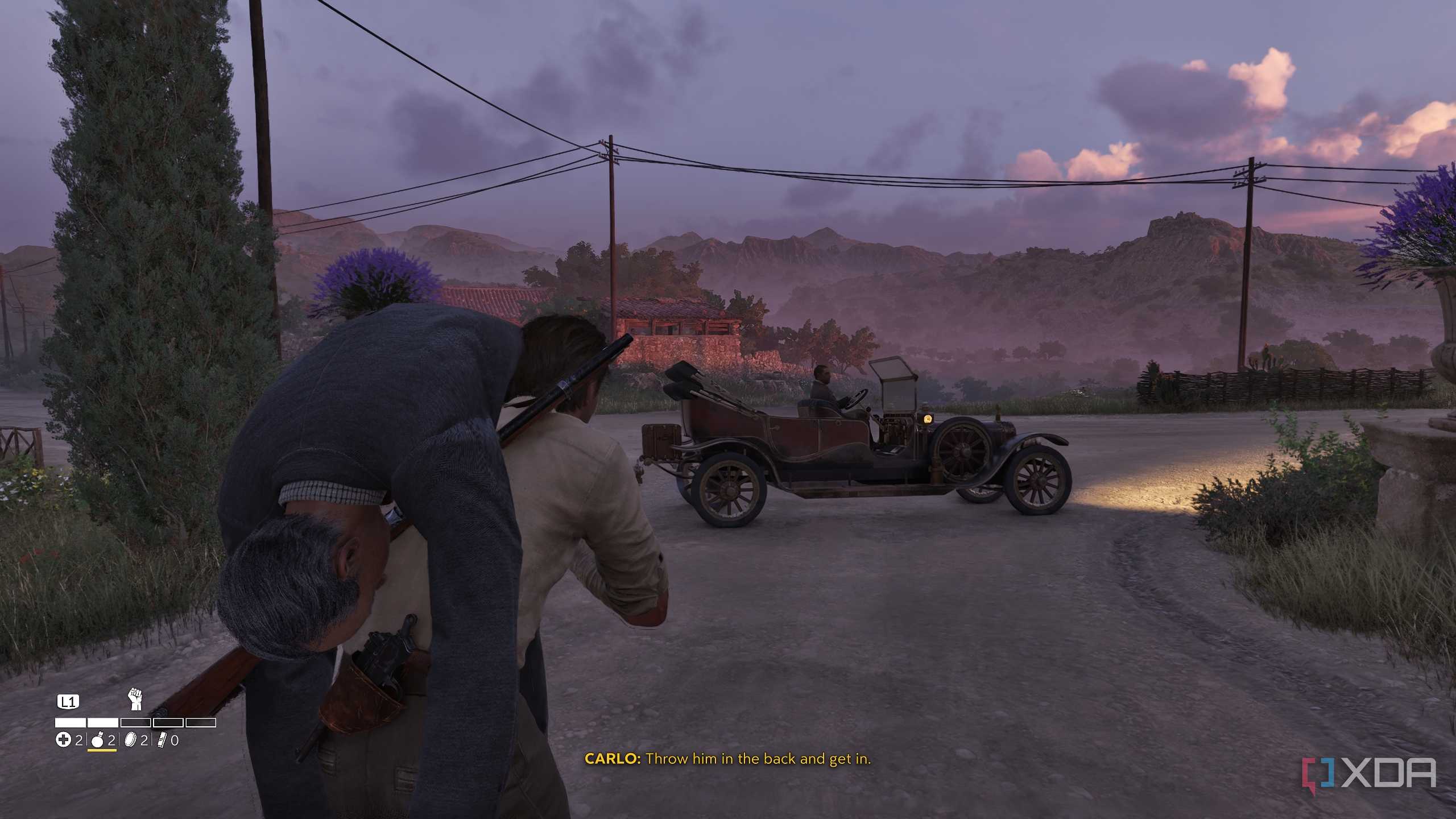 Carrying a man towards a car in Mafia: The Old Country.