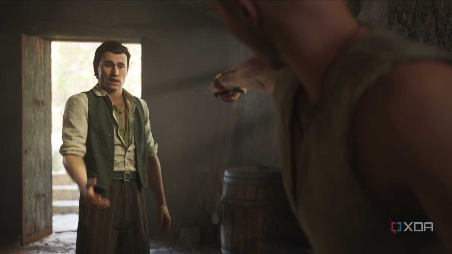 Enzo holding a knife at Cesare in Mafia: The Old Country.