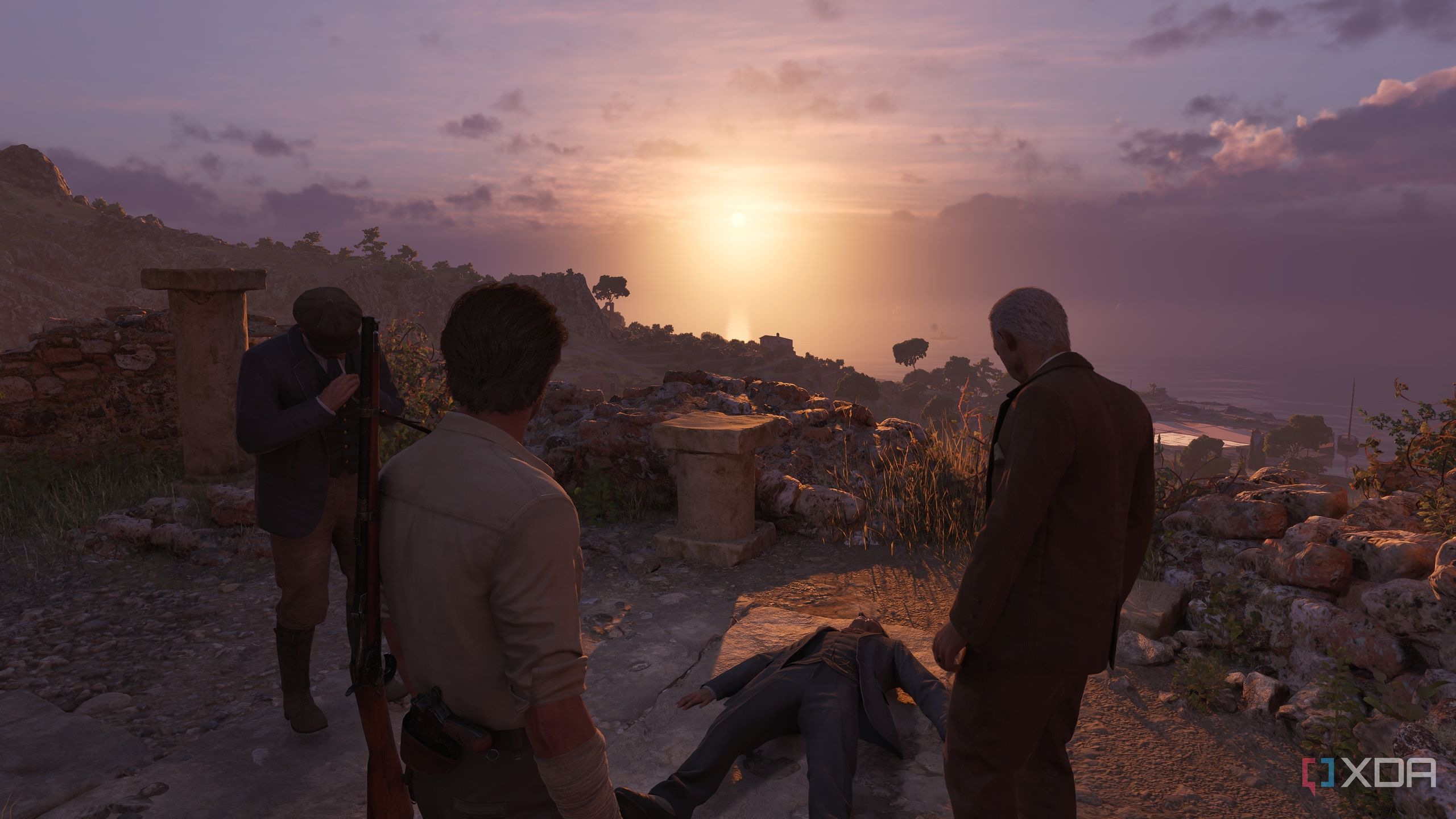 Enzo and Tino Russo standing over an unconscious person at sunset in Mafia: The Old Country.