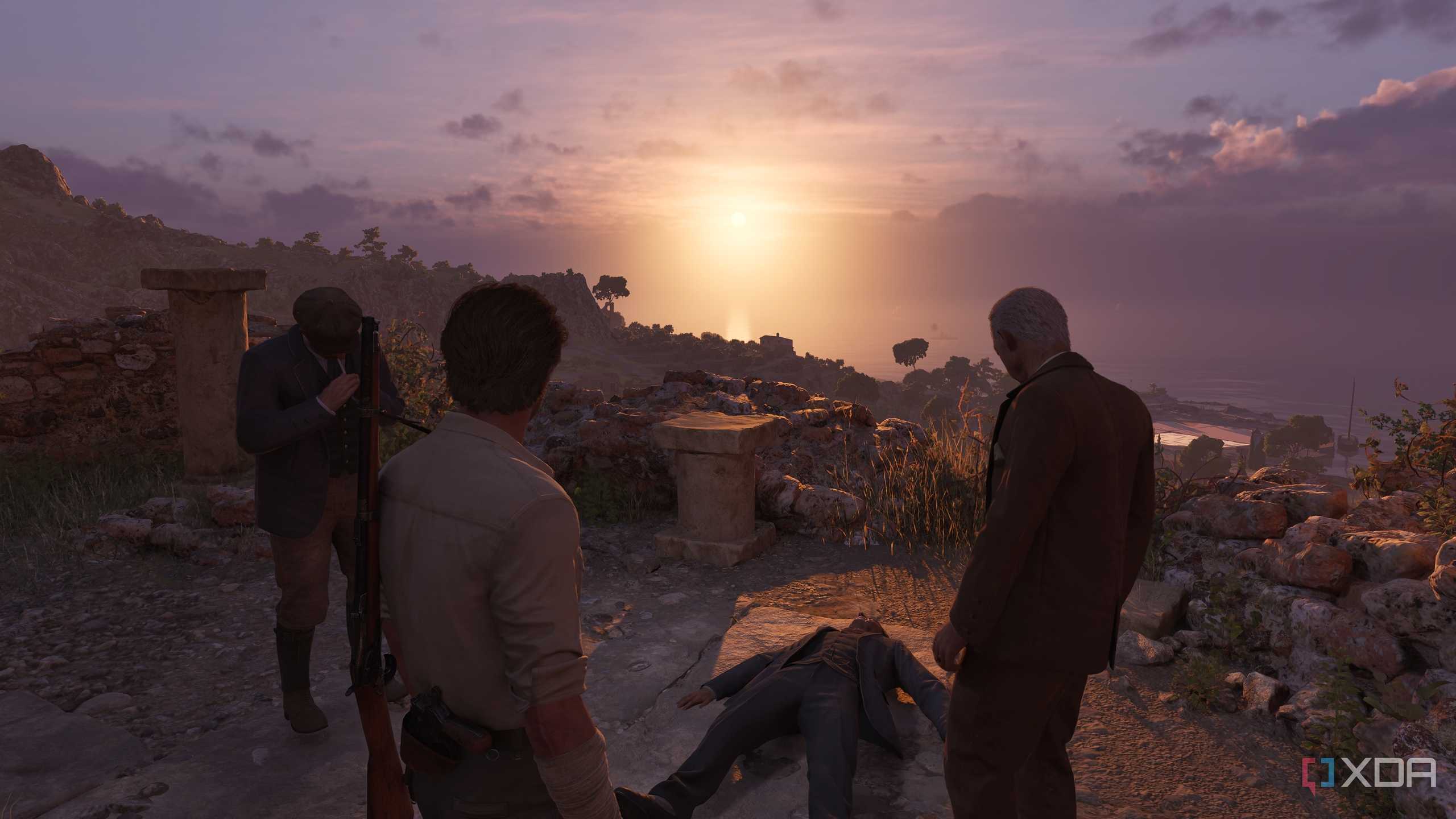 Enzo and Tino Russo standing over an unconscious person at sunset in Mafia: The Old Country.